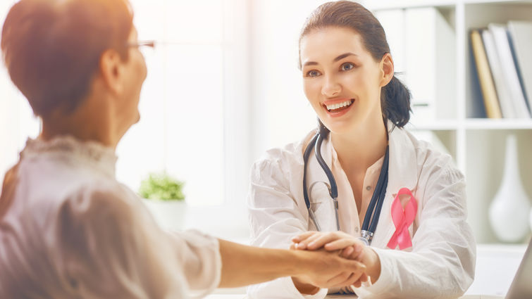 patient and doctor sit together