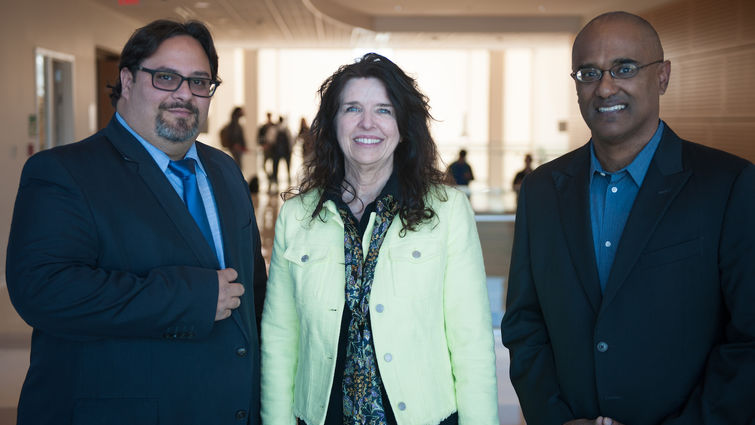 Three people standing together