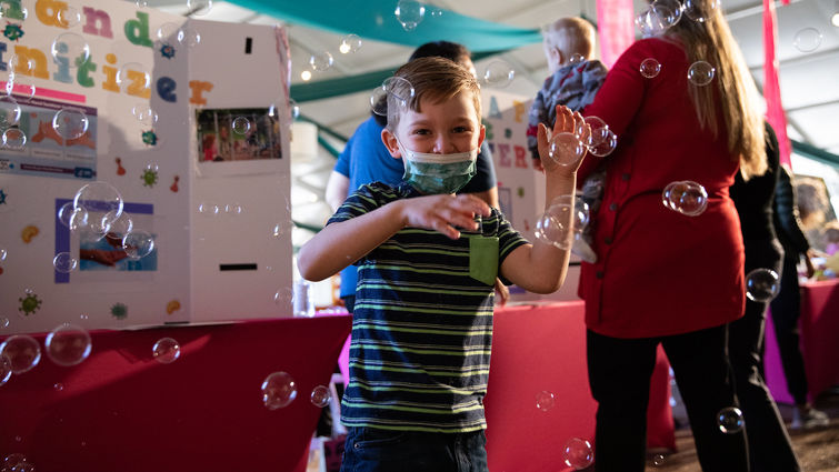 Young boy playing with bubbles