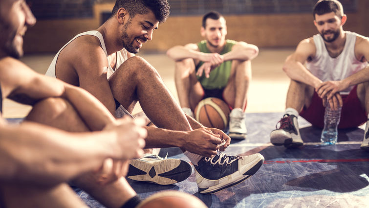 Young men taking a break from basketball