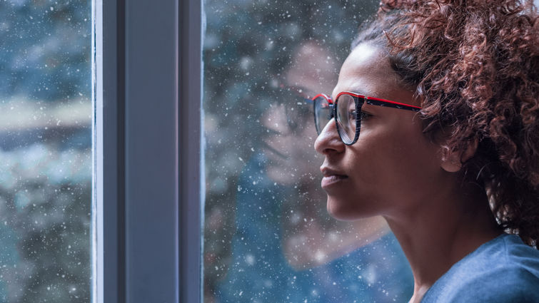 woman looking out the window