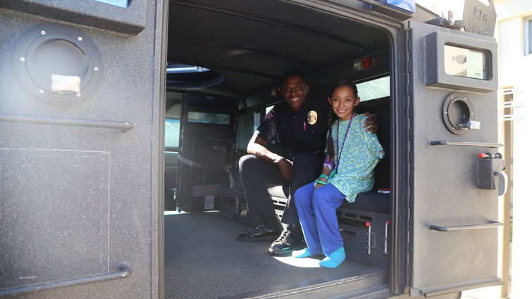 LLUCH patient Cailin Marcial, 9, from Colton, took a tour of a SWAT van that made its way on to the hospital campus during the 19th annual Cops for Kids Fly-in.