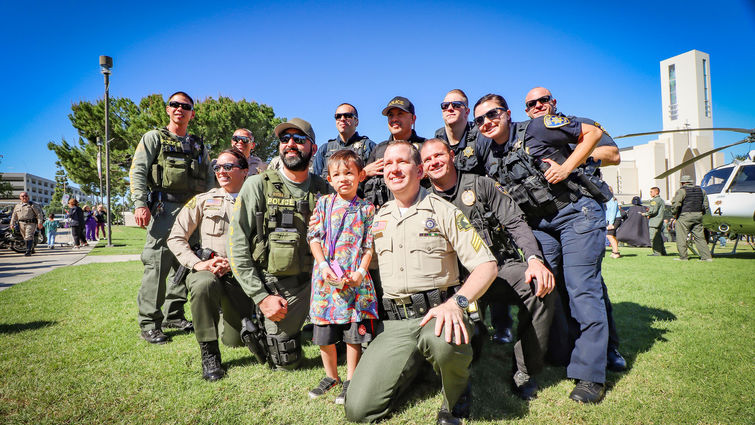 Loma Linda University Children’s Hospital patient, Rocky Zepeda, 6, of Victorville, with his new friends and role models at the 20th annual Cops for Kids Fly-In on Tuesday, Oct 16.