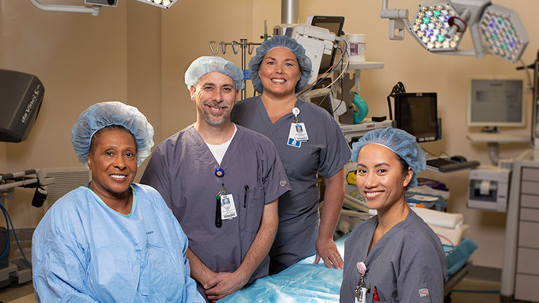 four nurse employees pose for photo