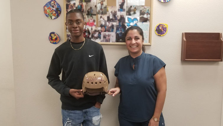 doctor and patient hold life saving helmet