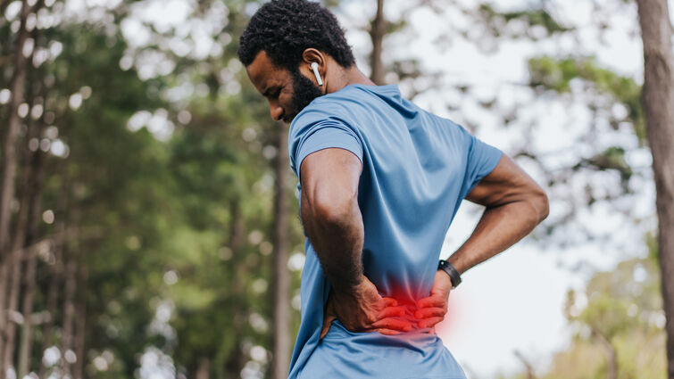 Portrait of a mature man with back pain 