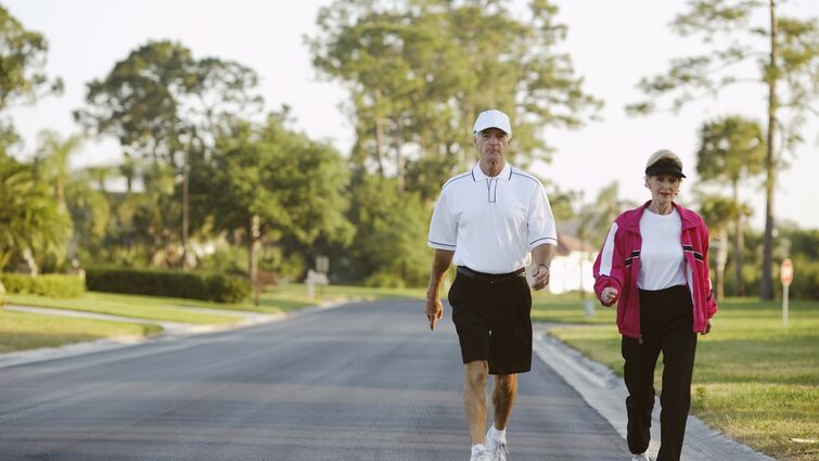 Senior couple power walking