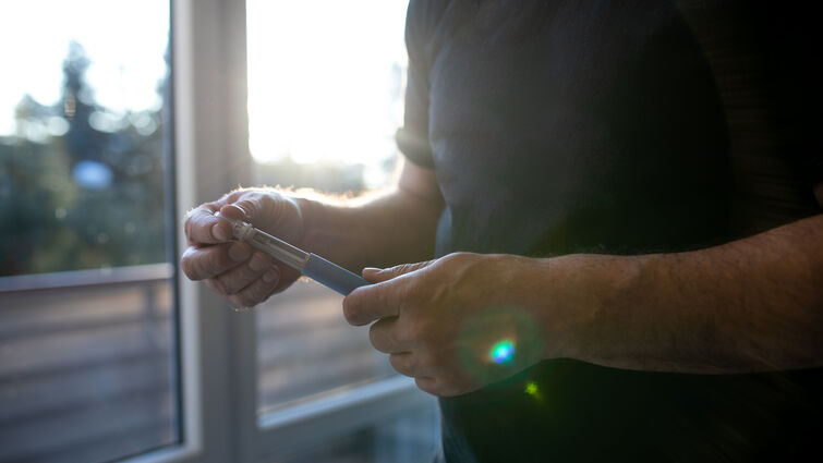 a man holds a injectable medicine 