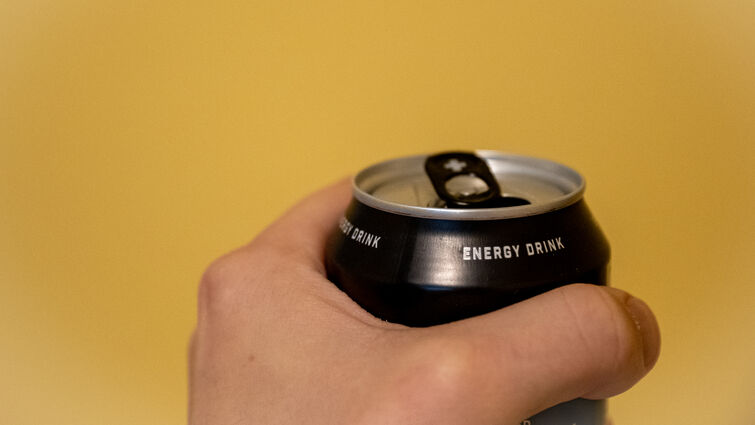 Hand holding energy drink