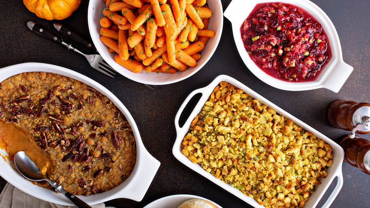 Platters of thanksgiving food on a table