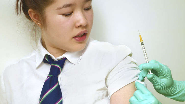 teenager receiving vaccine