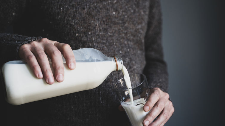Man pouring a glass of milk
