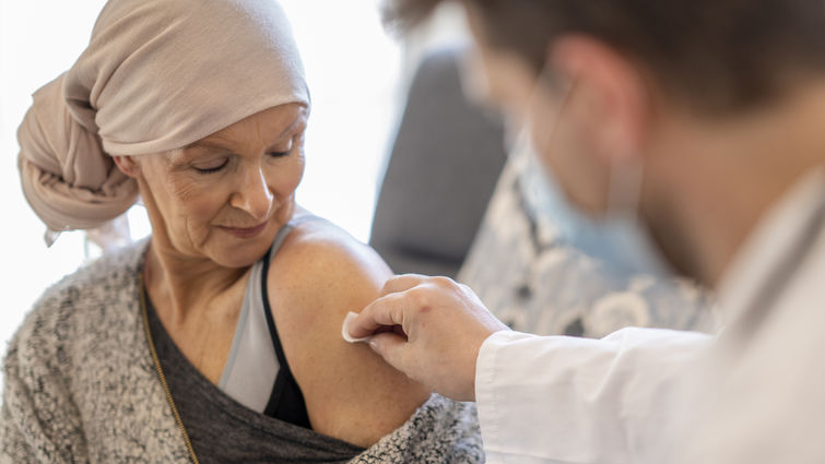 Patient with cancer receiving vaccination