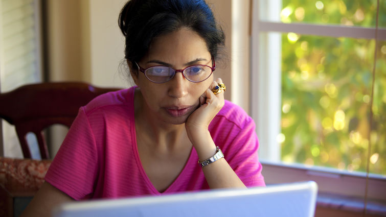 Woman looking at a laptop