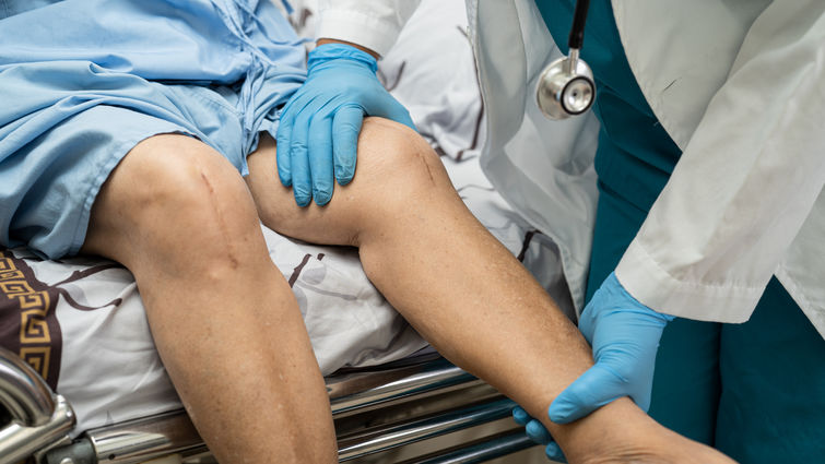 Person being prepped for knee surgery