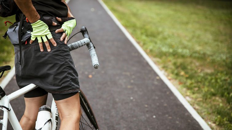 Hip pain cyclist stock photo