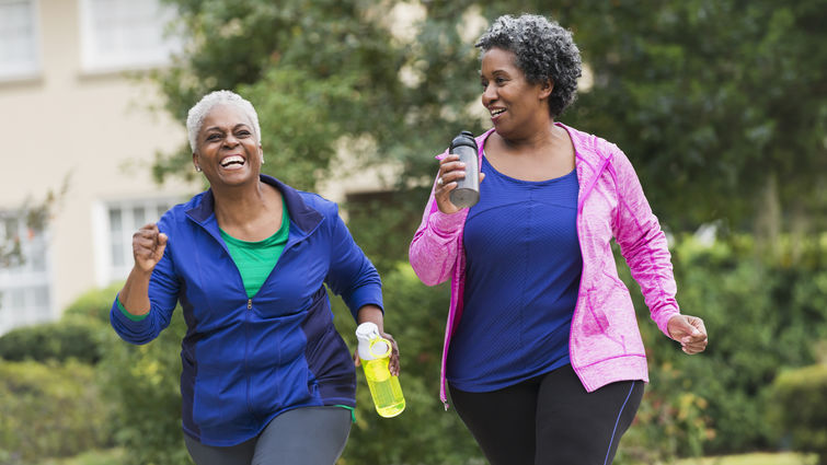 There is a 4-to-1 female-to-male ratio for the prevalence of osteoporosis because women lose 1 to 2% of their bone mass during the first five years of menopause, according to LLUH doctors. Two senior black women exercising together stock photo
