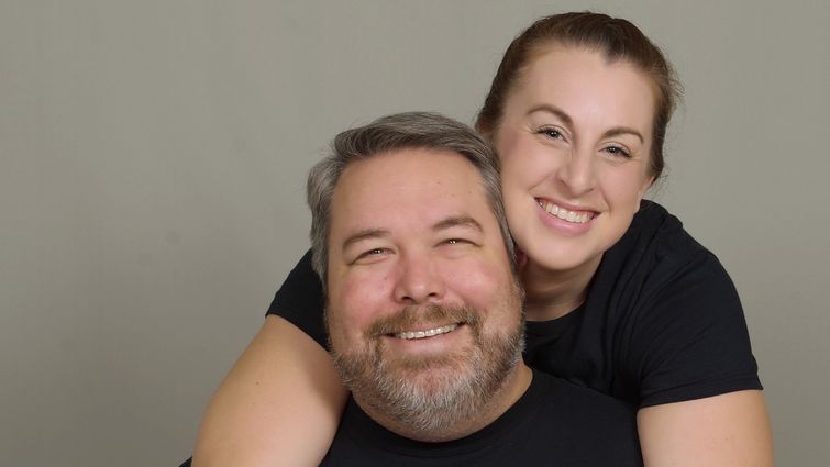 Adam and Roseanna Brown posing and smiling together