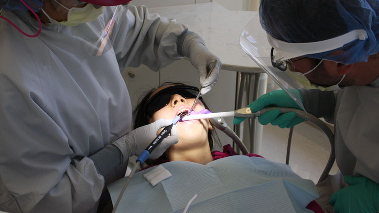 LLU dental students enact roles of operators and patients during the study's clinical trial