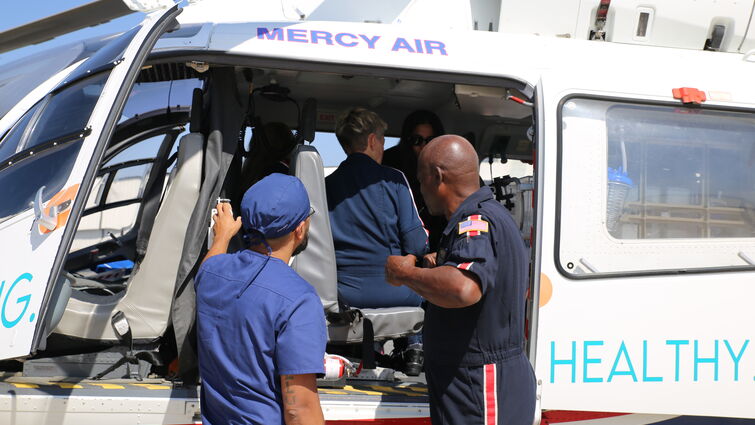 transport team member looks into helicopter during training