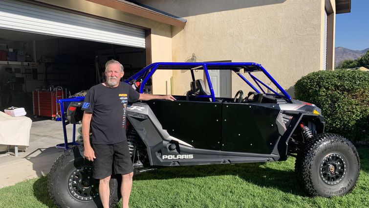 Eric Nelson poses with his off-roading vehicle.