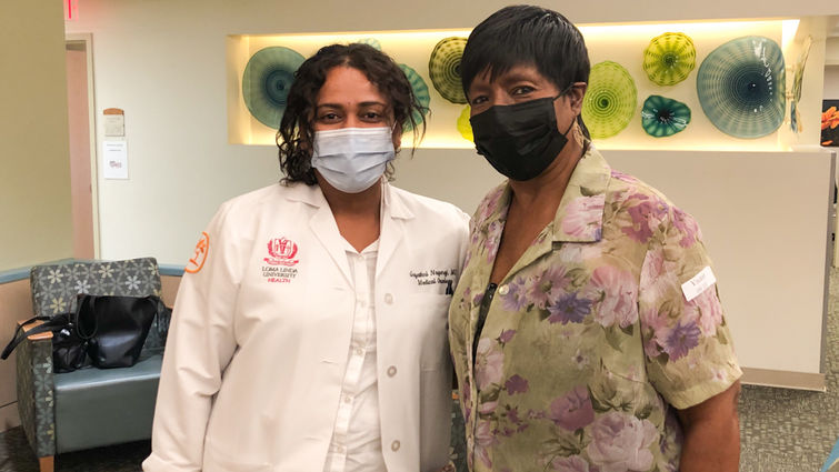 From left: Dr. Gayathri Nagaraj and Katie Smith with masks on