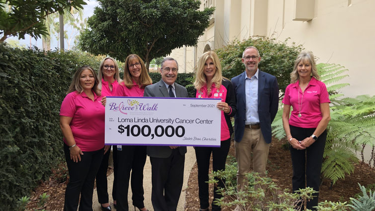 Stater Bros. Charities and Inland Women Fighting Cancer present a $100,000 check to LLU Cancer Center