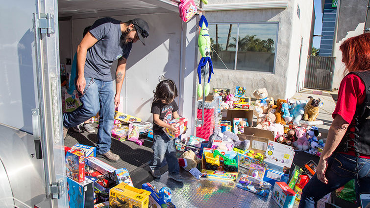 child picks toy from trailer