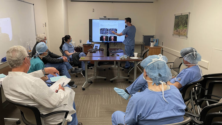 Team of LLU specialists assemble in a room to analyze images and discuss cases of patients like Dennis Davis. Team of specialists assembled in a room analyze images