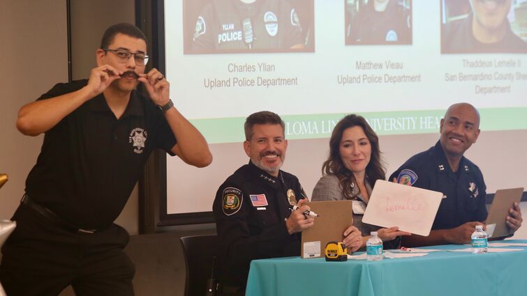 a man shows off his beard for judges to vote on