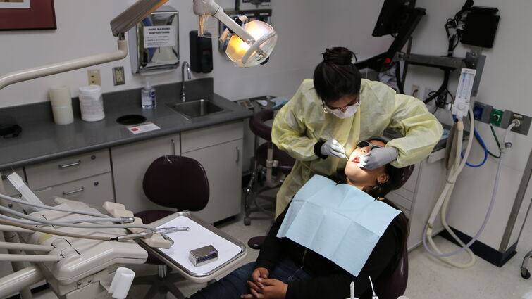 Dental patient sits in chair for treatment at LLU pediatric dental clinic