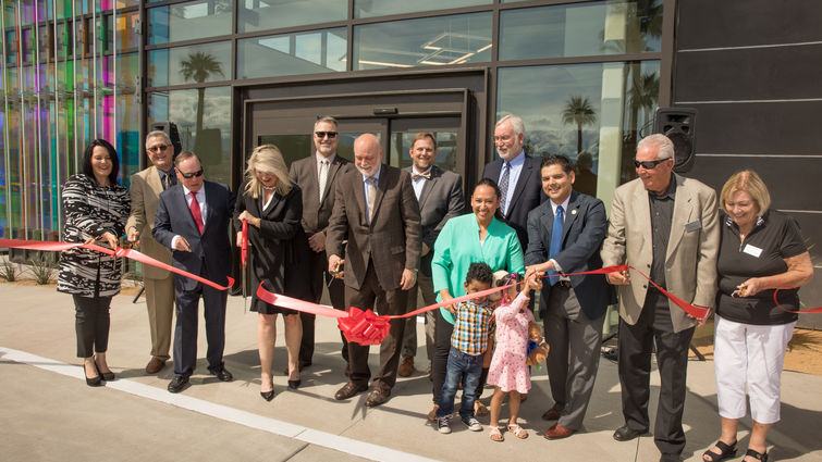 Group of people just after ribbon is cut