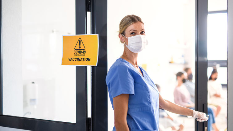 Portrait of nurse with face mask looking at camera, coronavirus, covid-19 and vaccination concept