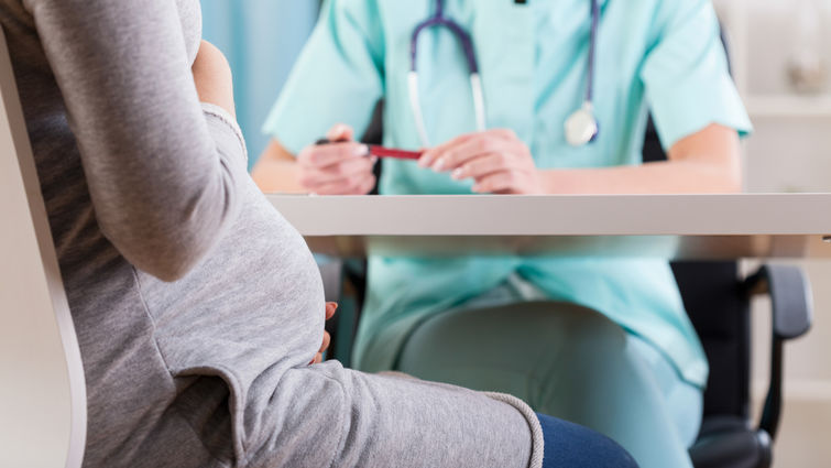 Close-up of a pregnant woman during medical visit