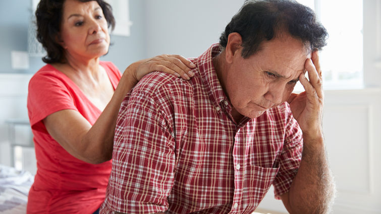 Wife comforting husband with dementia