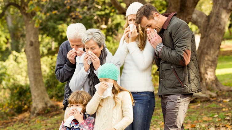 Sick family blowing their noses