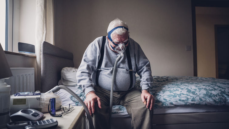 Elderly Man Using a Medical Breathing Apparatus stock photo Elderly Man Using a Medical Breathing Apparatus stock photo