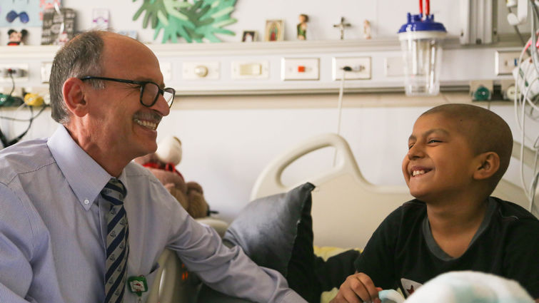 LLUCH physician Dr. Albert Kheradpour enjoys a moment of laughter while treating a patient at Loma Linda University Children’s Hospital.