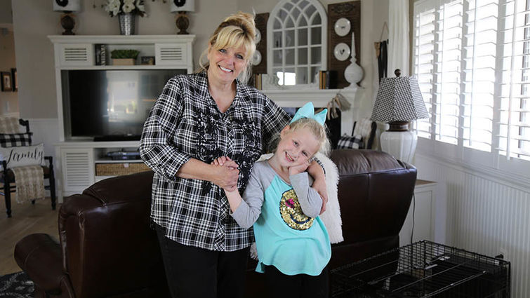 Mary Ann Wells and her new daughter Sophia Genesis Wells, 8, at home in Yucaipa.