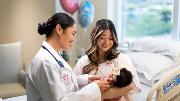 Doctor with mother and baby