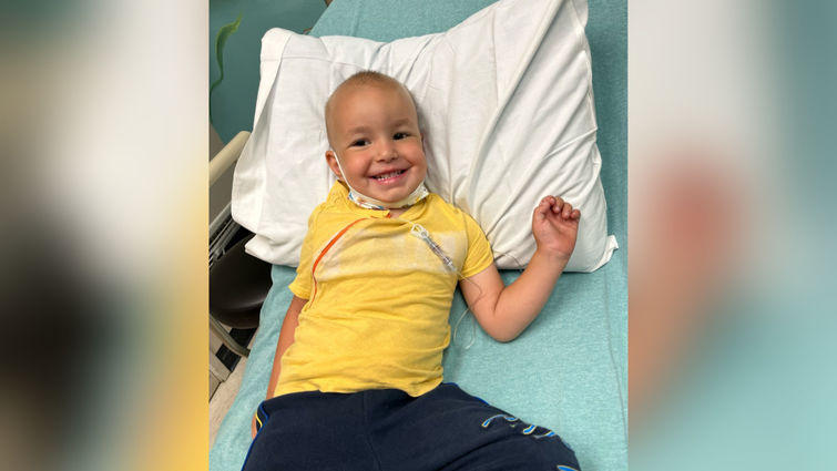 Boy receiving cancer treatment in hospital room