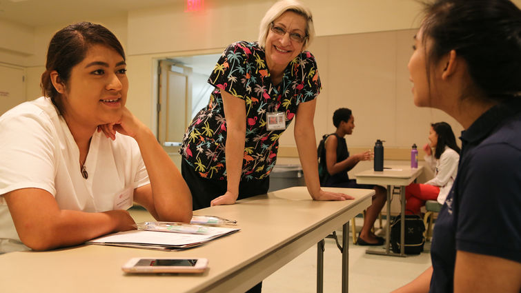 students sit at a table