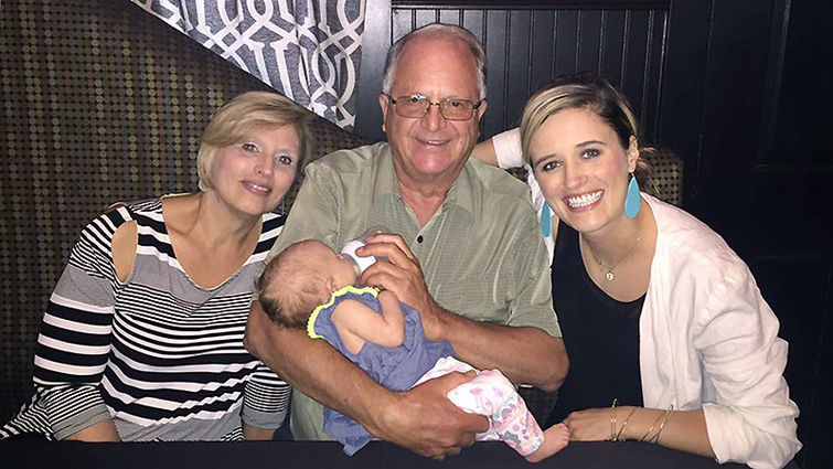 During Rob Newbold’s visit to Dubuque, Iowa, Beth Gilbreath was able to fulfill a wish she’d had since the family left California — taking a photo with Nurse Robb. From left, Beth Gilbreath, Rob Newbold, RN (holding Elleora) and Christina Jennings.