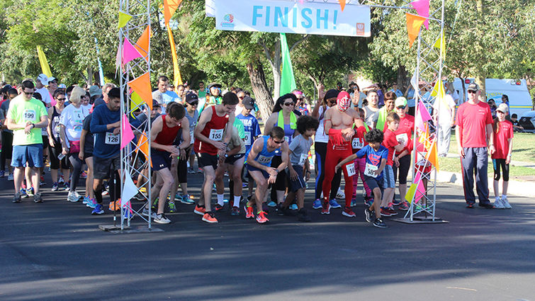 Runners in the Stand Up to Stigma 5K get ready to start their race.
