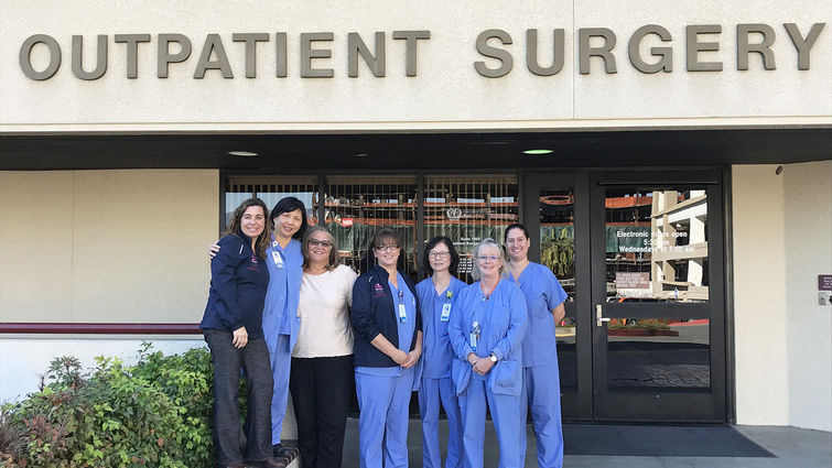 Group of female nurses in front of building