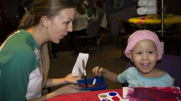 LLUCH patient Adamaris Camacho, 4, of San Bernardino enjoyed her camp experience with The Painted Turtle Outpost while painting with Amanda Willms.
