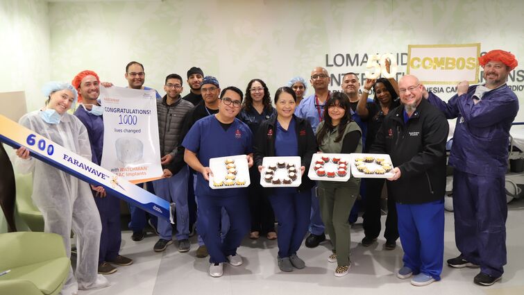 a group of medical employees pose for a photo