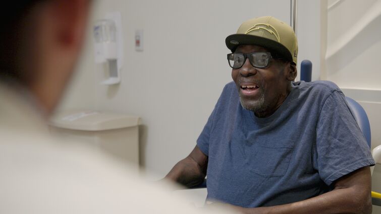 Edwin speaking with Dr. Peters