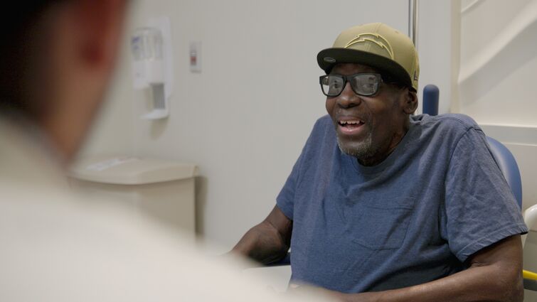 Edwin speaking with Dr. Peters