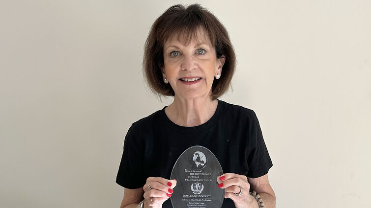 Robin Ungar with her duplicate award from School of Allied Health Professions.